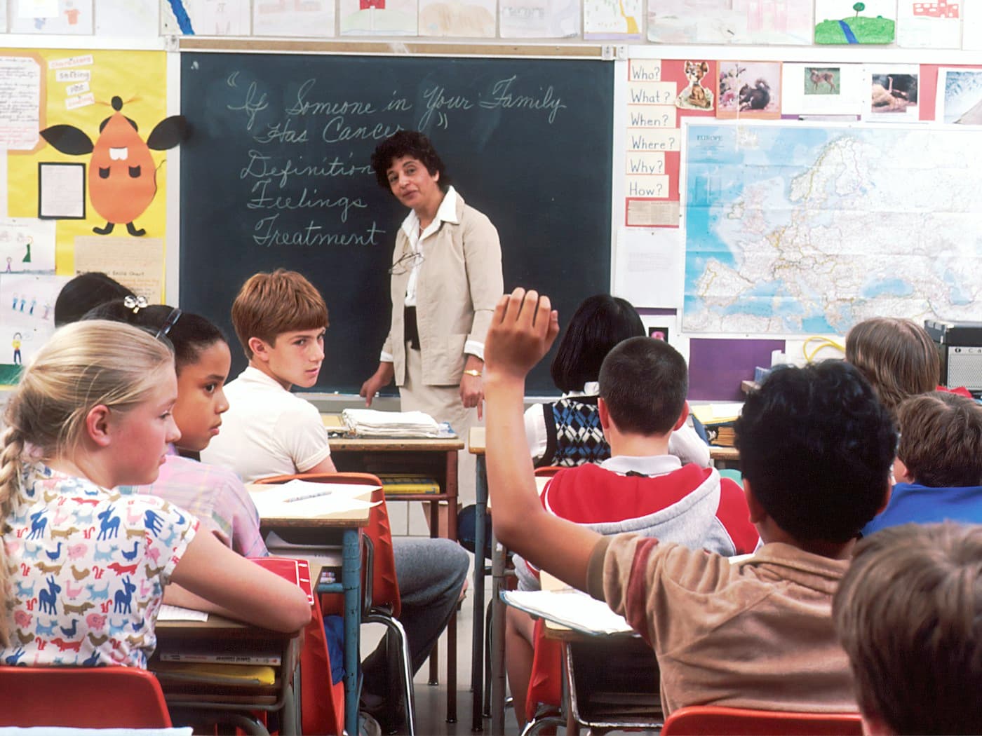 A teacher leading a full classroom